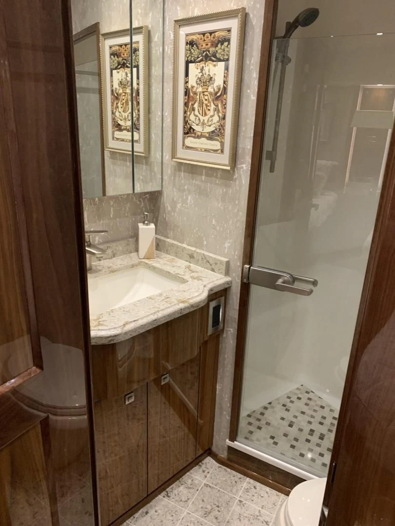 a bathroom with a sink and a shower aboard AFTER MIDNIGHT Yacht for Sale