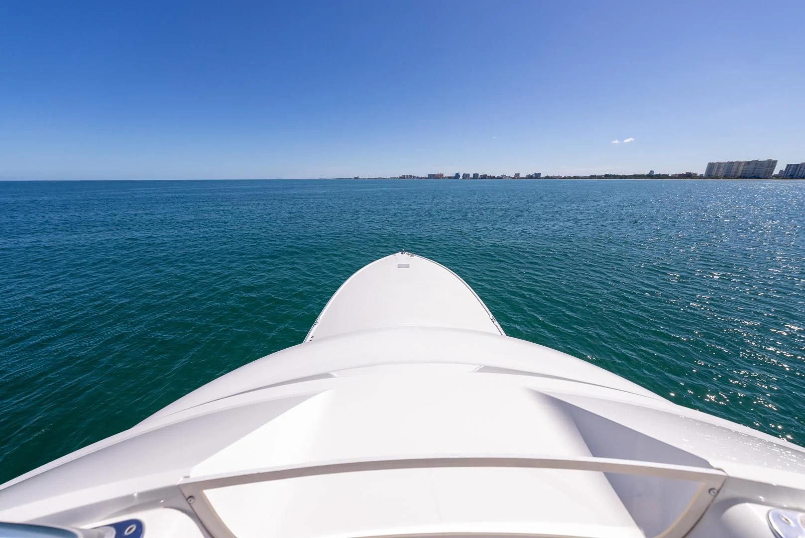 a white boat in the water aboard AFTER MIDNIGHT Yacht for Sale