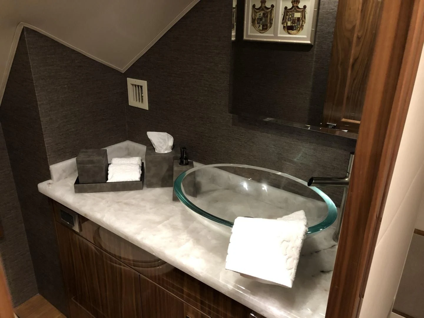 a bathroom with a large round sink aboard AFTER MIDNIGHT Yacht for Sale