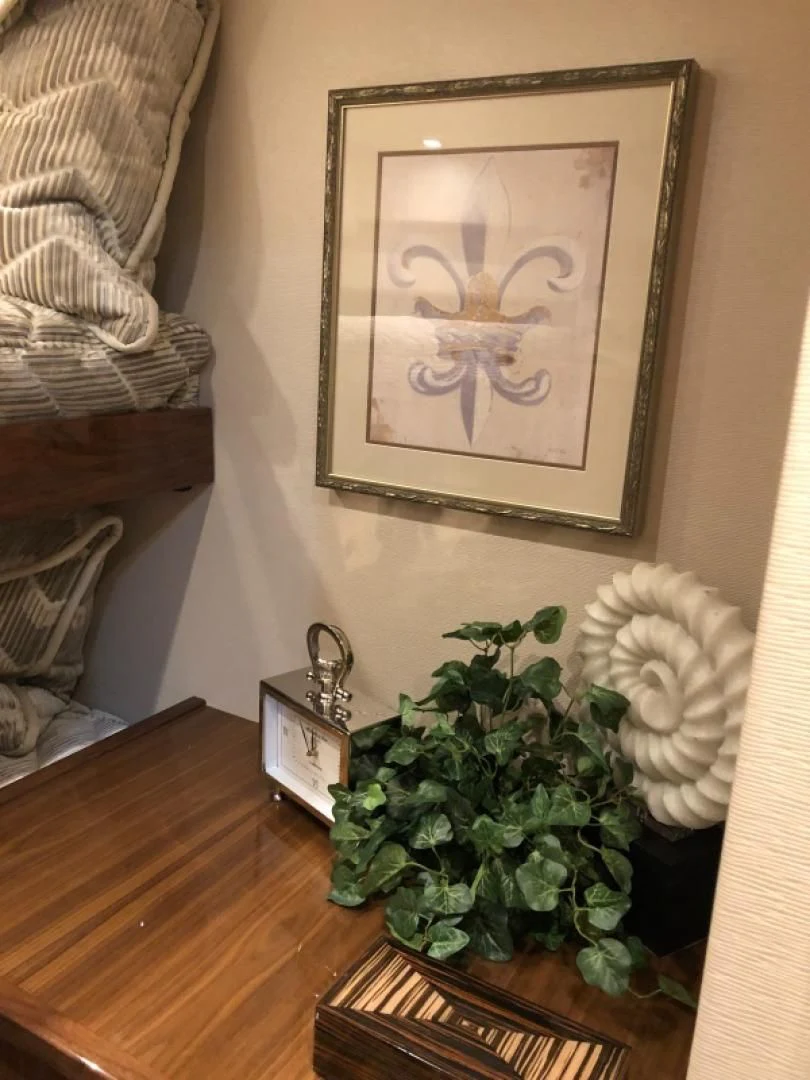 a table with a picture on it aboard AFTER MIDNIGHT Yacht for Sale
