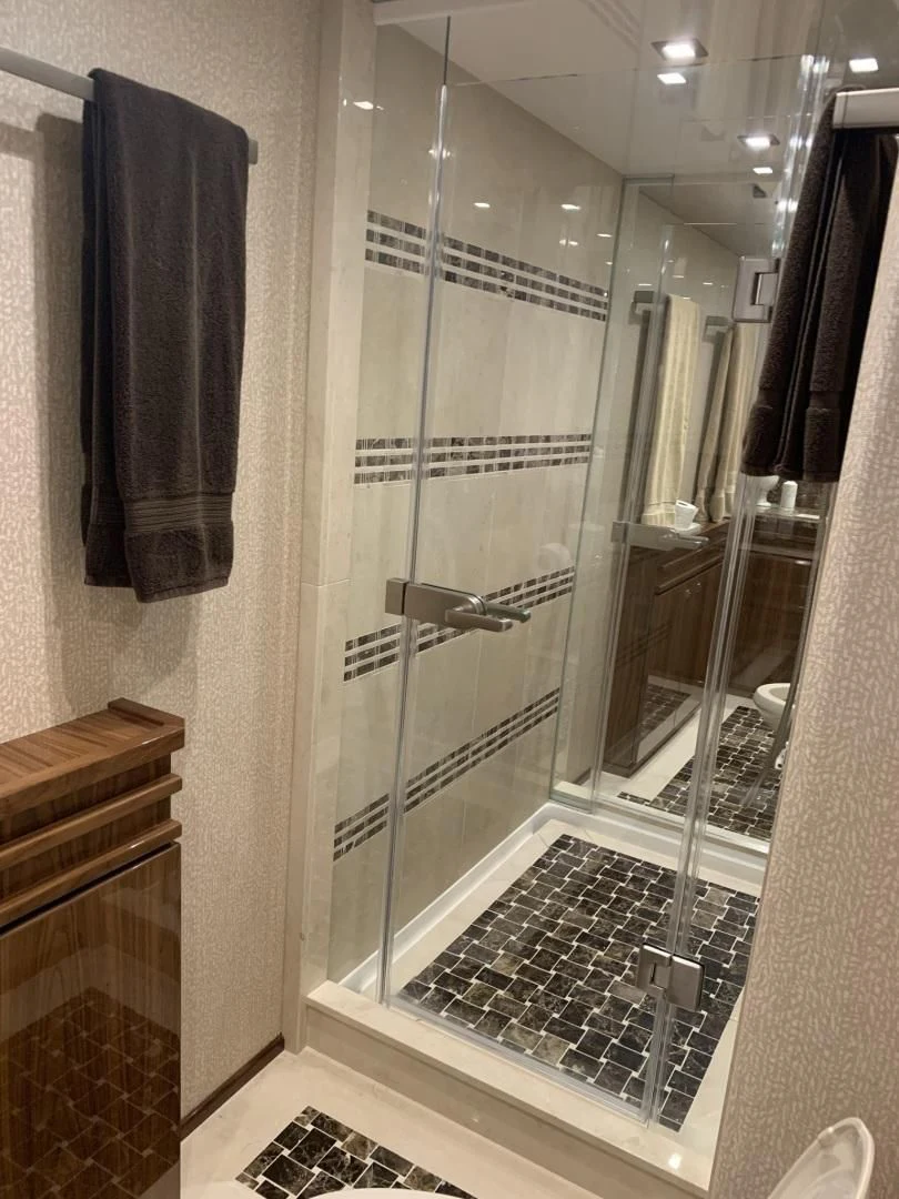 a glass shower unit aboard AFTER MIDNIGHT Yacht for Sale