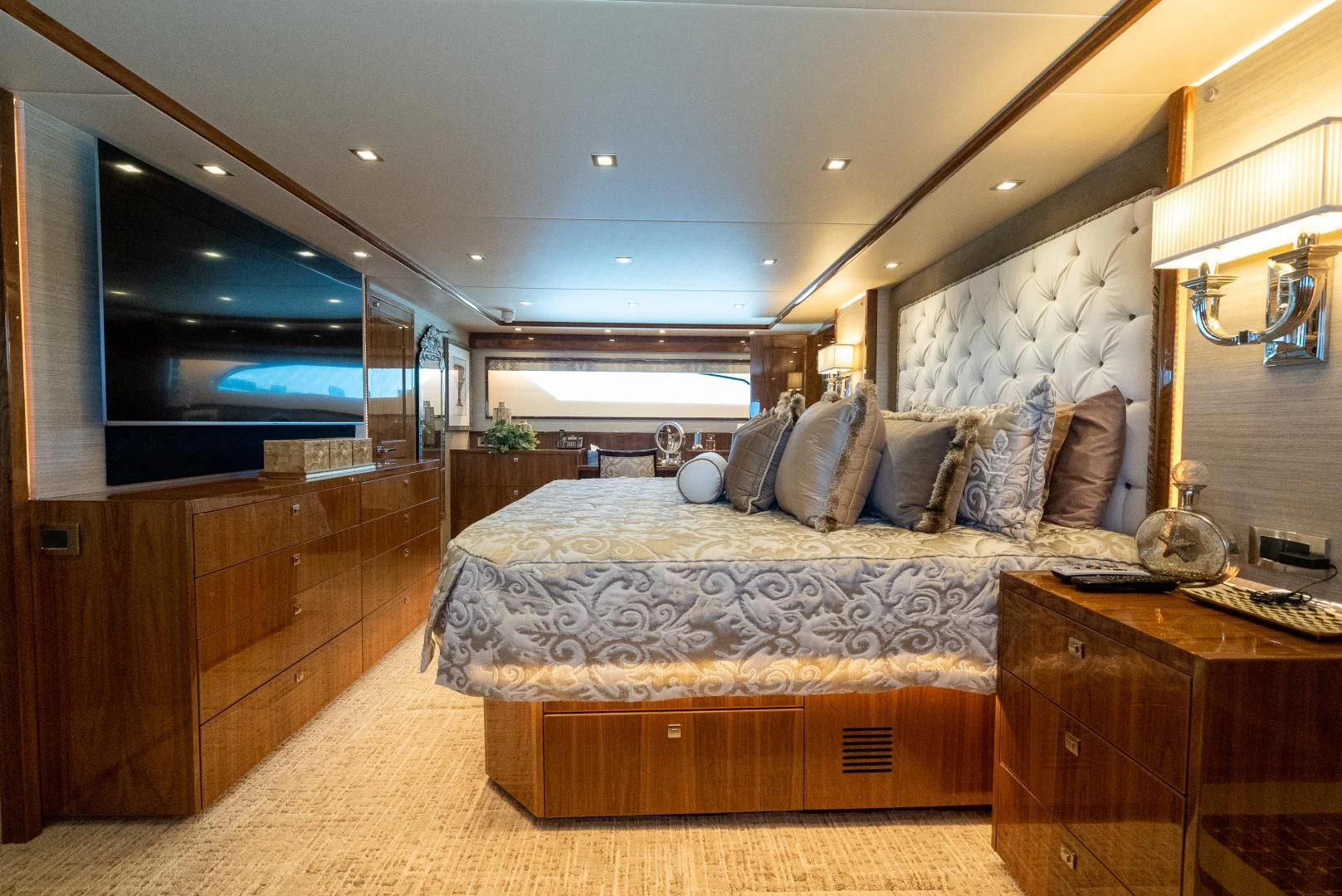 a bedroom with a large bed aboard AFTER MIDNIGHT Yacht for Sale