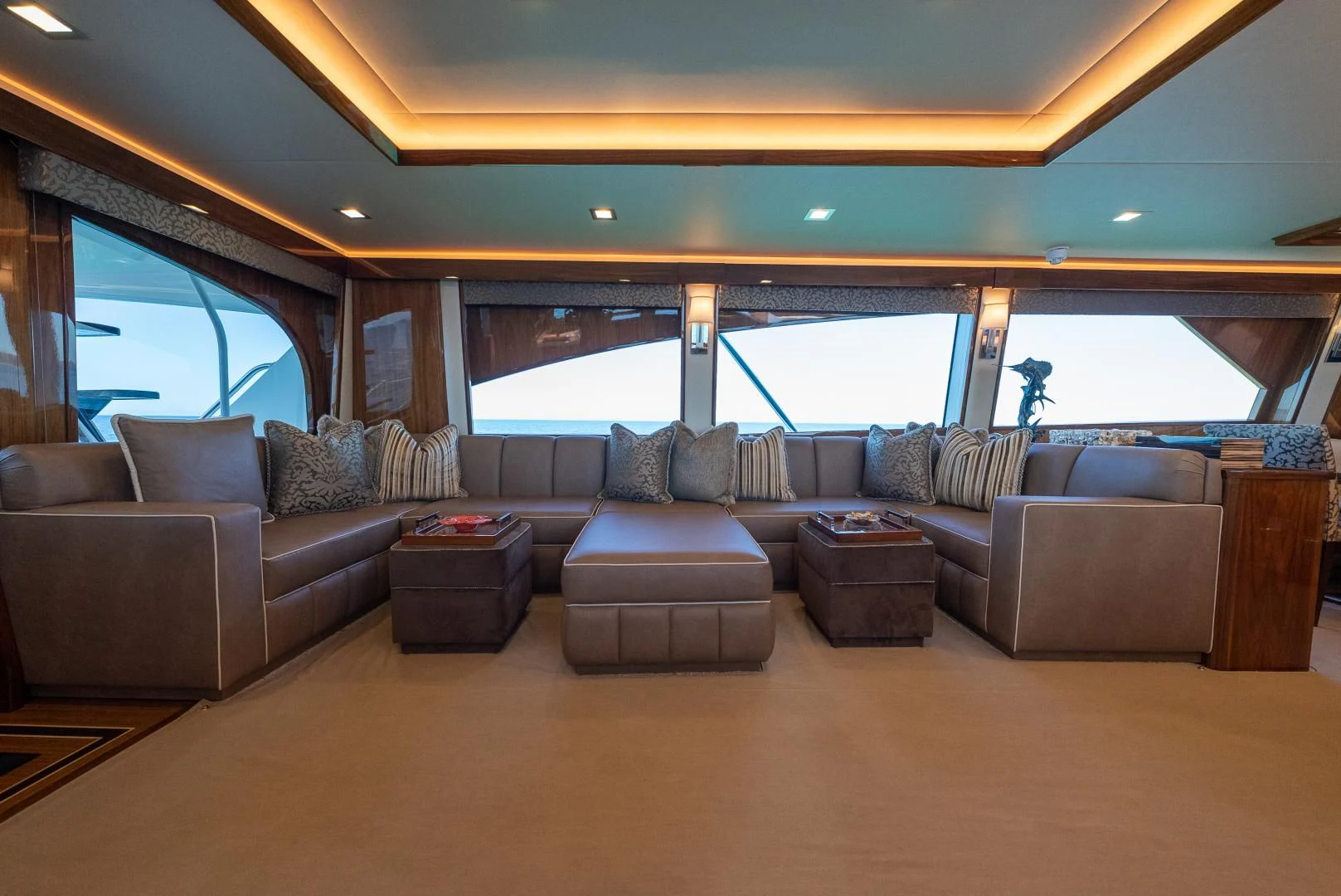 a living room with a large window aboard AFTER MIDNIGHT Yacht for Sale