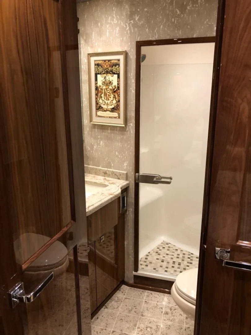 a bathroom with a sink and toilet aboard AFTER MIDNIGHT Yacht for Sale
