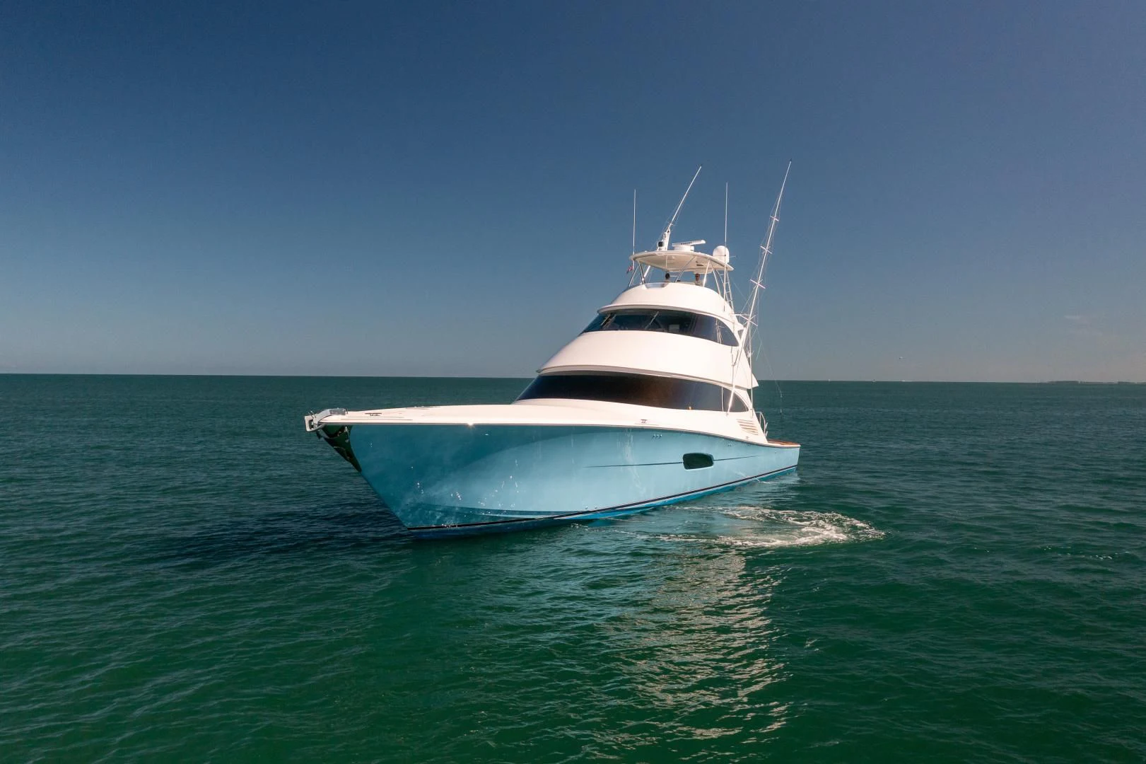a white boat in the water aboard AFTER MIDNIGHT Yacht for Sale