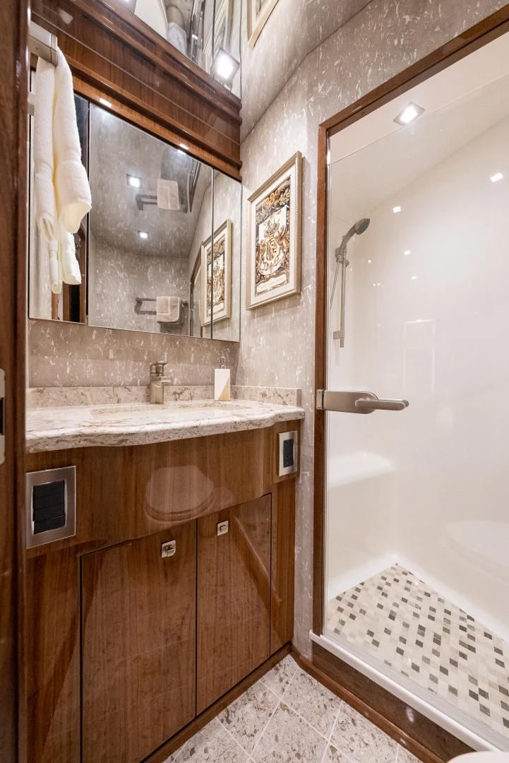 a bathroom with a sink and a mirror aboard AFTER MIDNIGHT Yacht for Sale