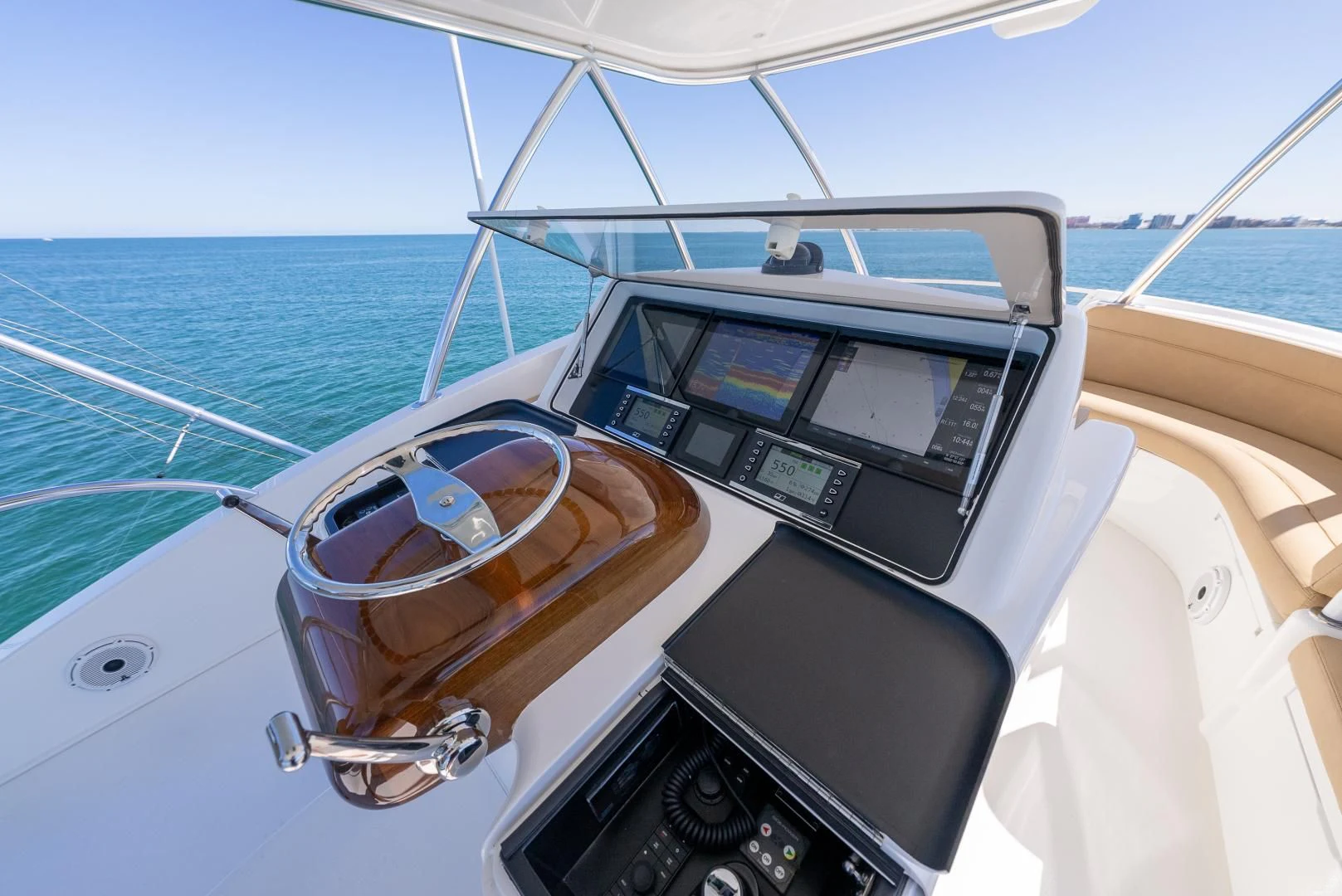 a boat with a steering wheel and a steering wheel on the front aboard AFTER MIDNIGHT Yacht for Sale