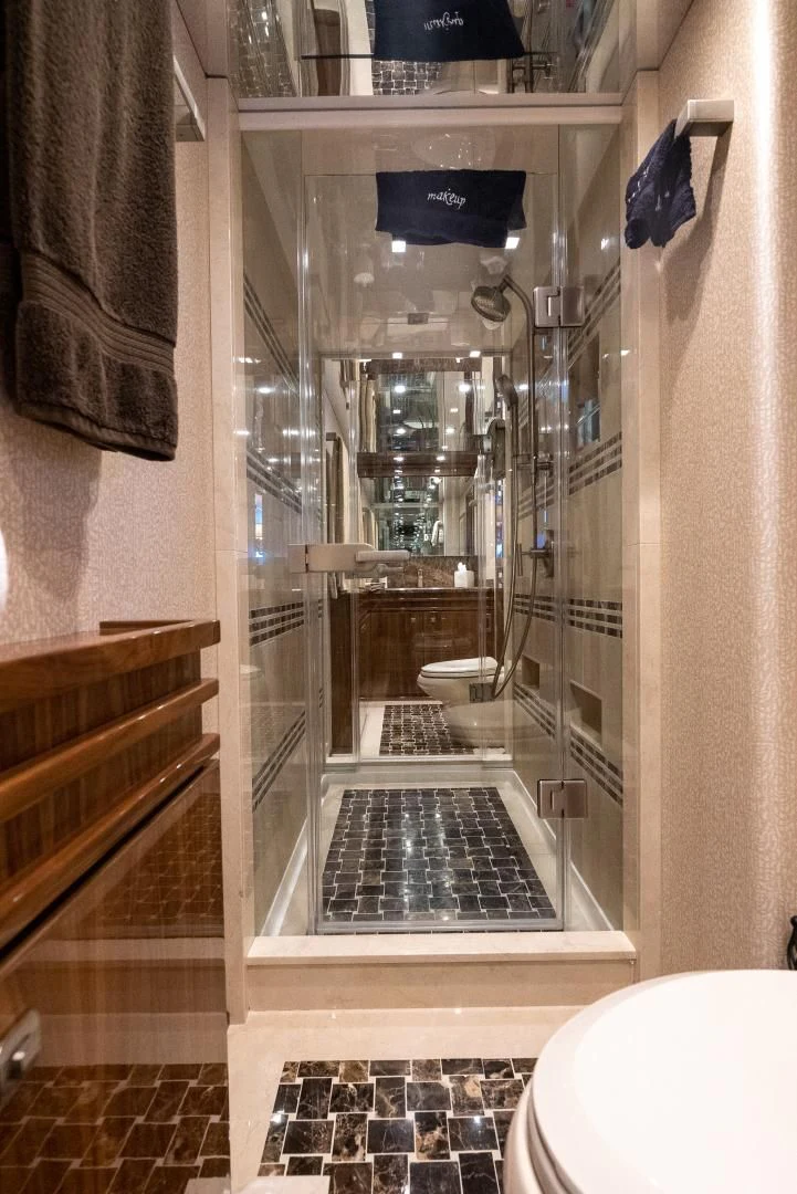 a shower unit with a glass door aboard AFTER MIDNIGHT Yacht for Sale