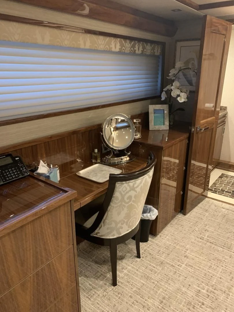 a desk with a chair and a mirror aboard AFTER MIDNIGHT Yacht for Sale