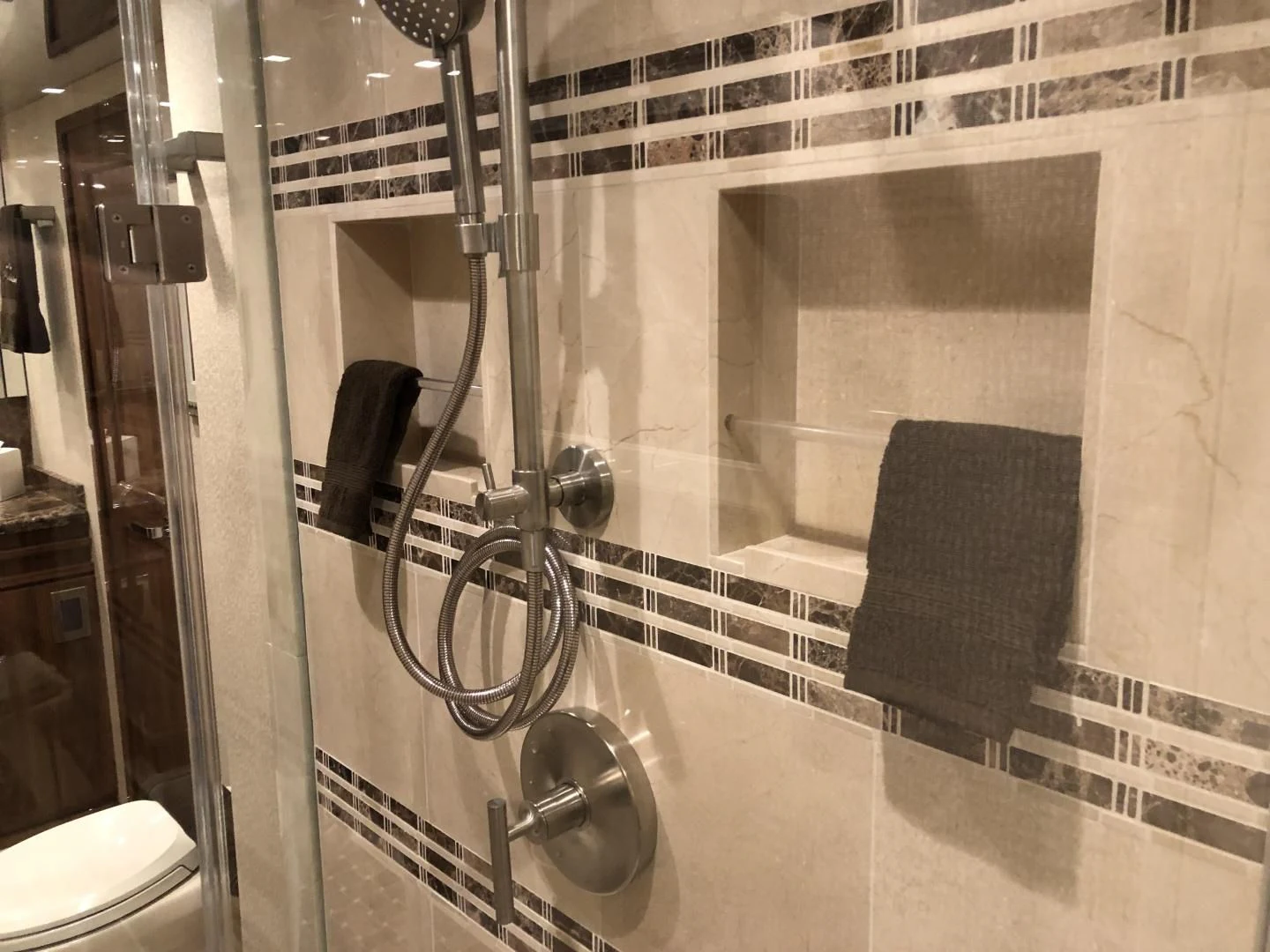 a bathroom with a shower unit aboard AFTER MIDNIGHT Yacht for Sale
