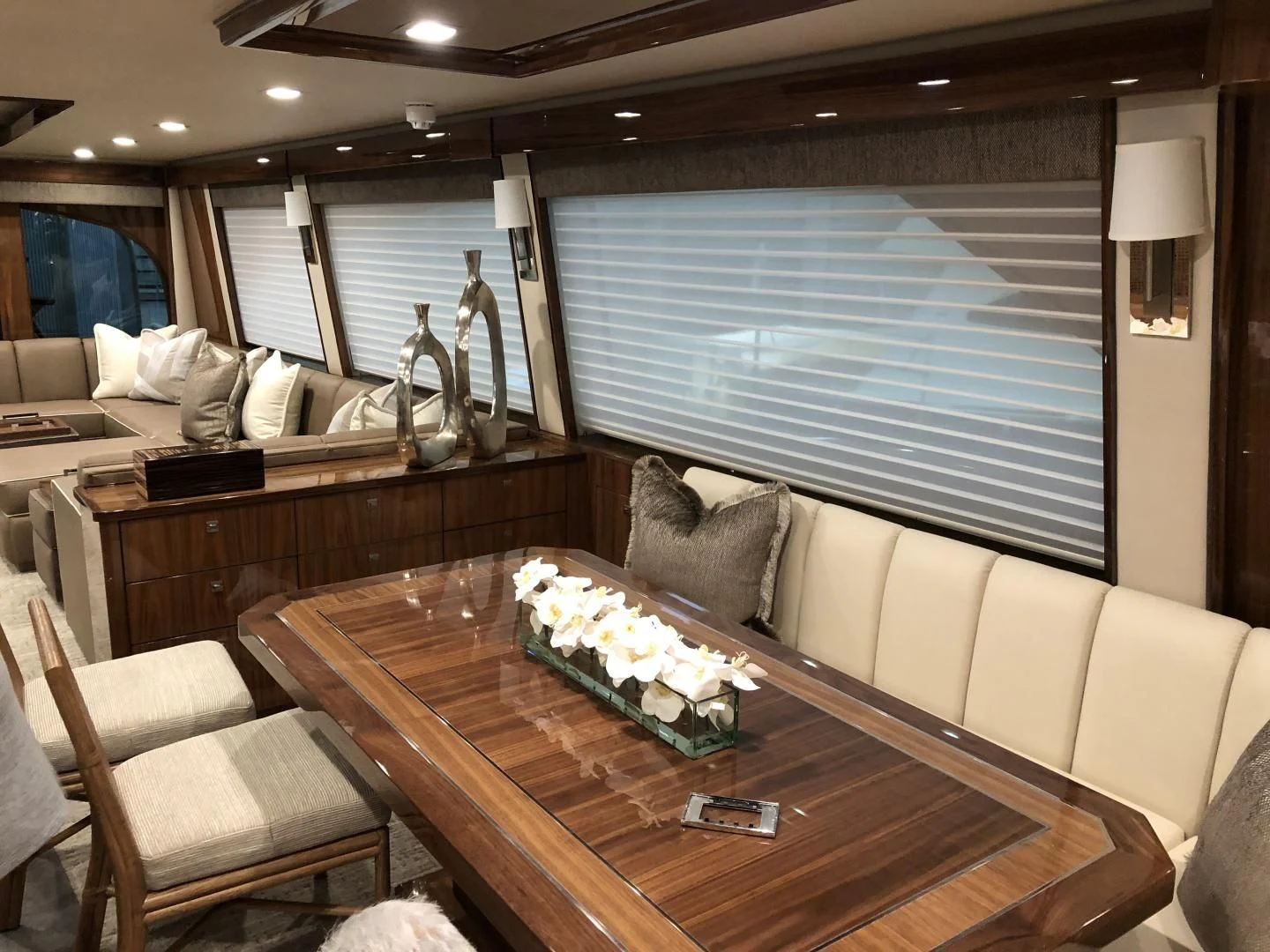 a room with a table and chairs aboard AFTER MIDNIGHT Yacht for Sale