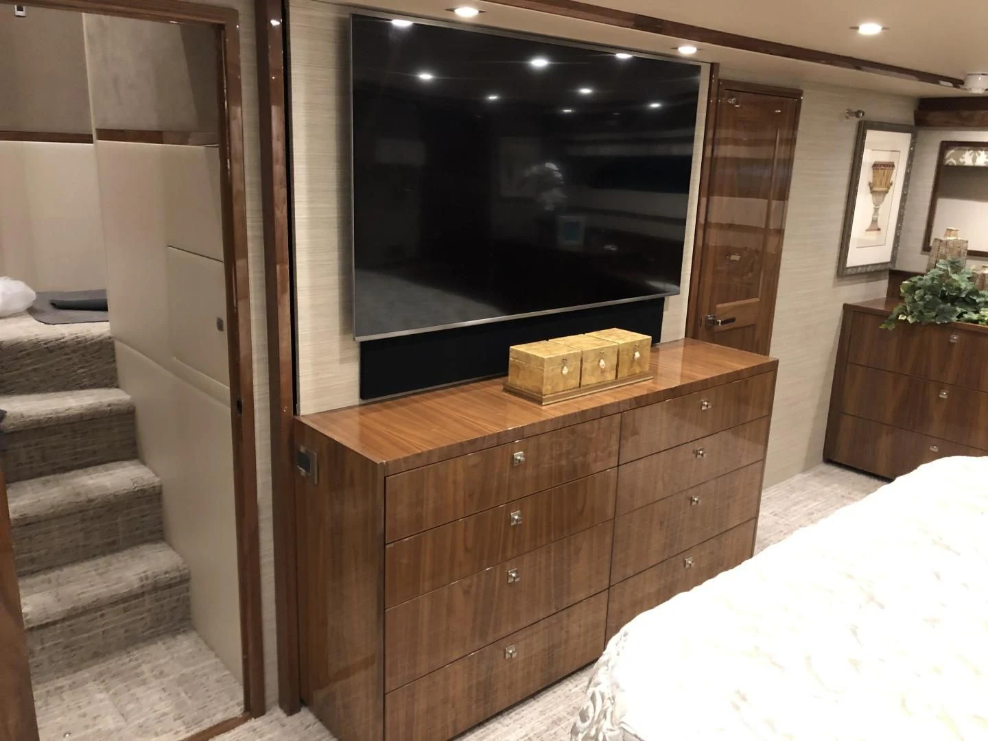 a tv on a cabinet aboard AFTER MIDNIGHT Yacht for Sale