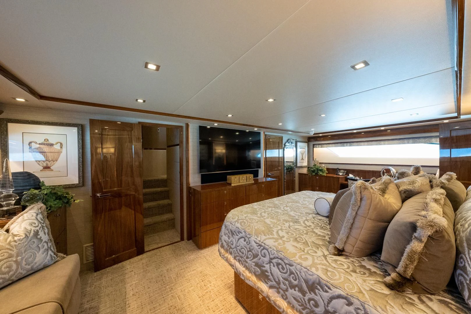 a large bedroom with a large bed aboard AFTER MIDNIGHT Yacht for Sale