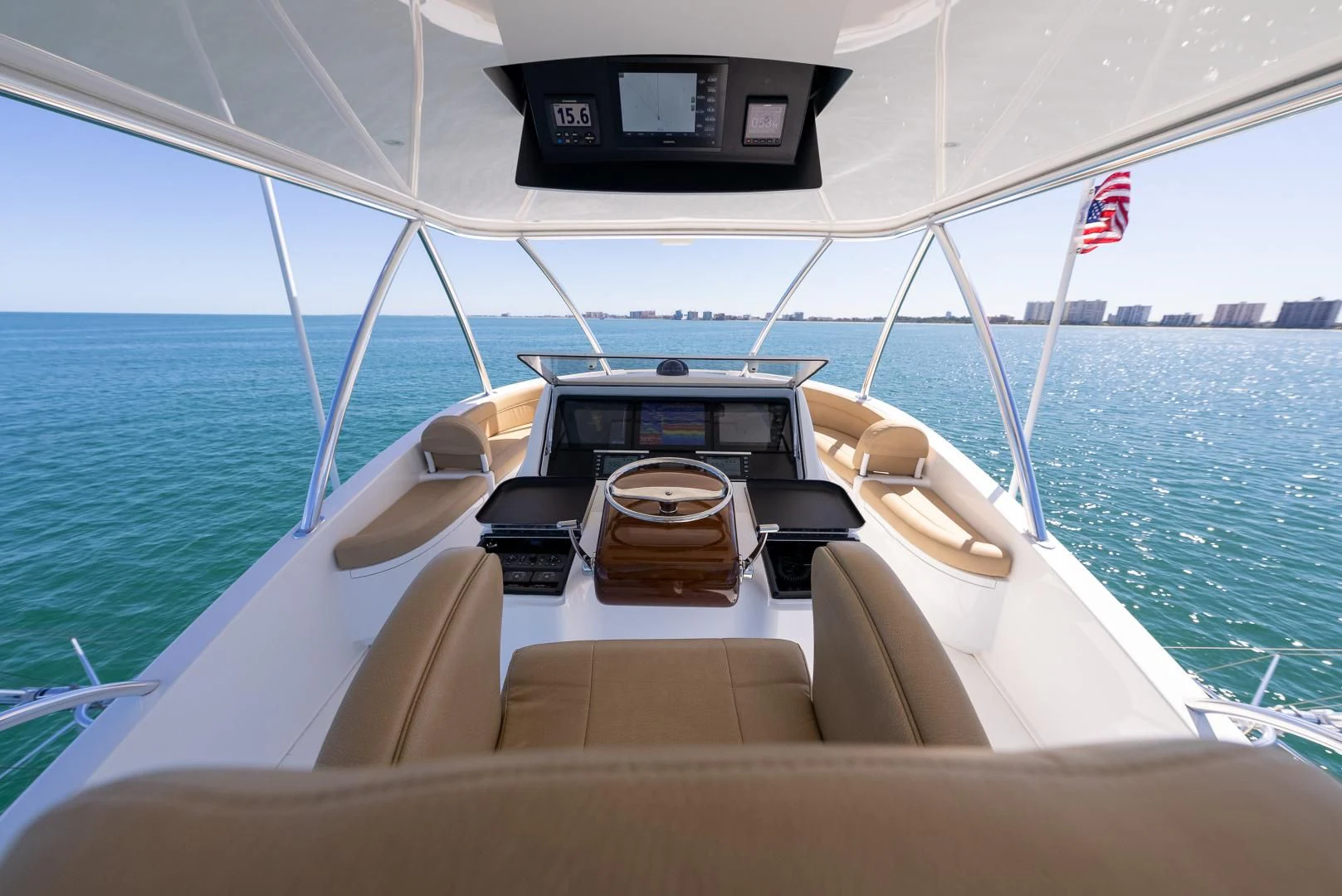 a boat with a seat and steering wheel on the front aboard AFTER MIDNIGHT Yacht for Sale