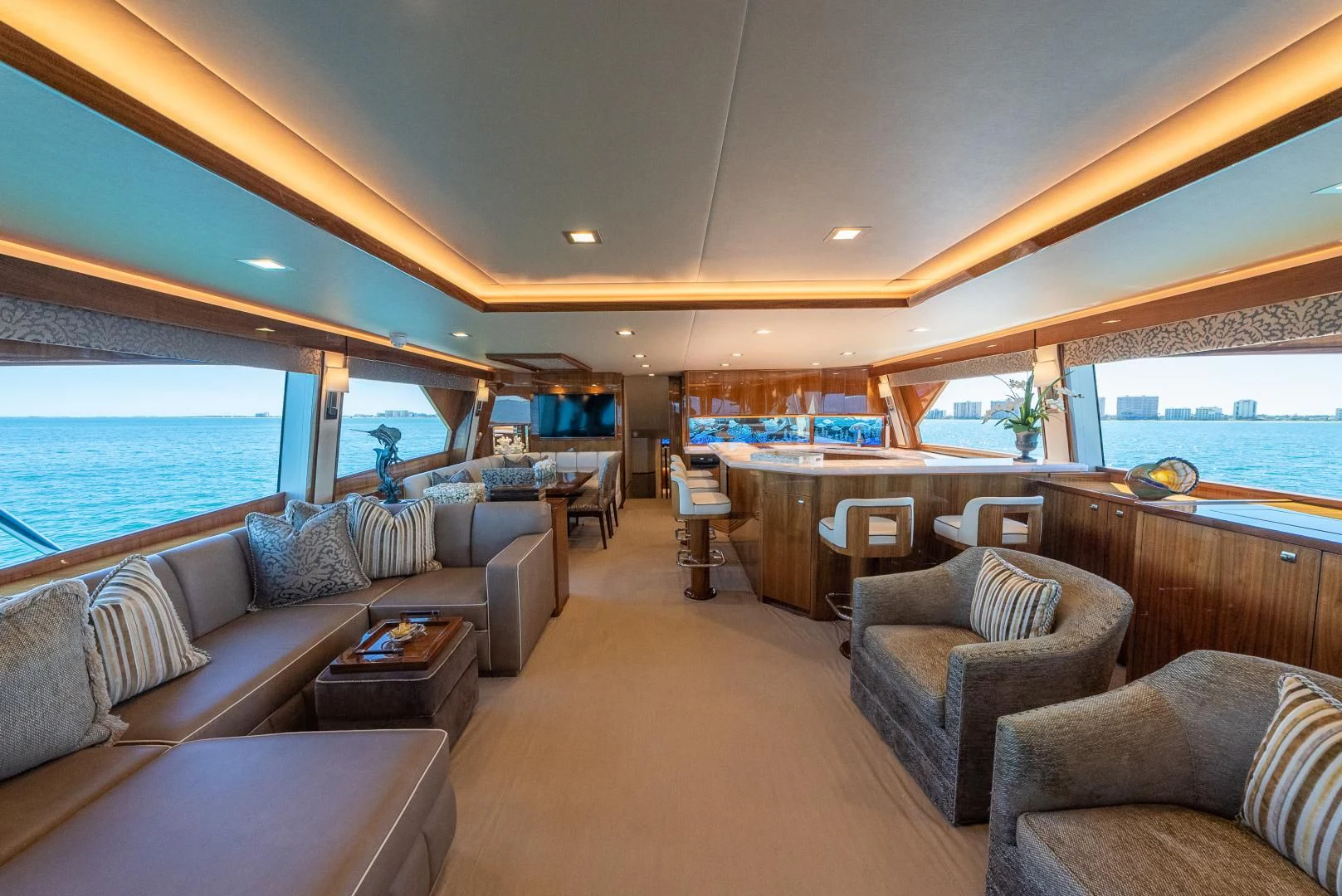 a living room with a large window aboard AFTER MIDNIGHT Yacht for Sale
