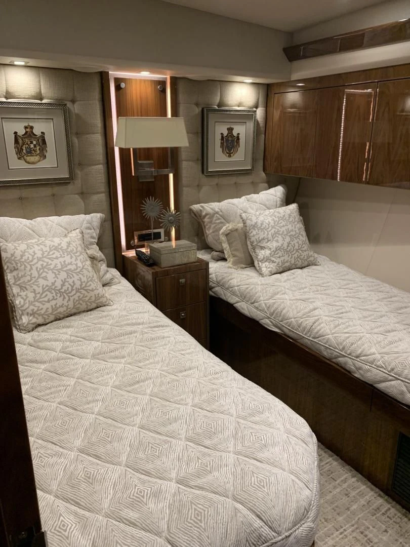 a couple of beds in a hotel room aboard AFTER MIDNIGHT Yacht for Sale