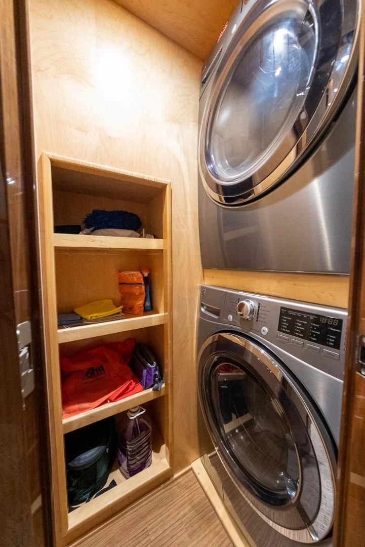 a kitchen with a washer and dryer aboard AFTER MIDNIGHT Yacht for Sale