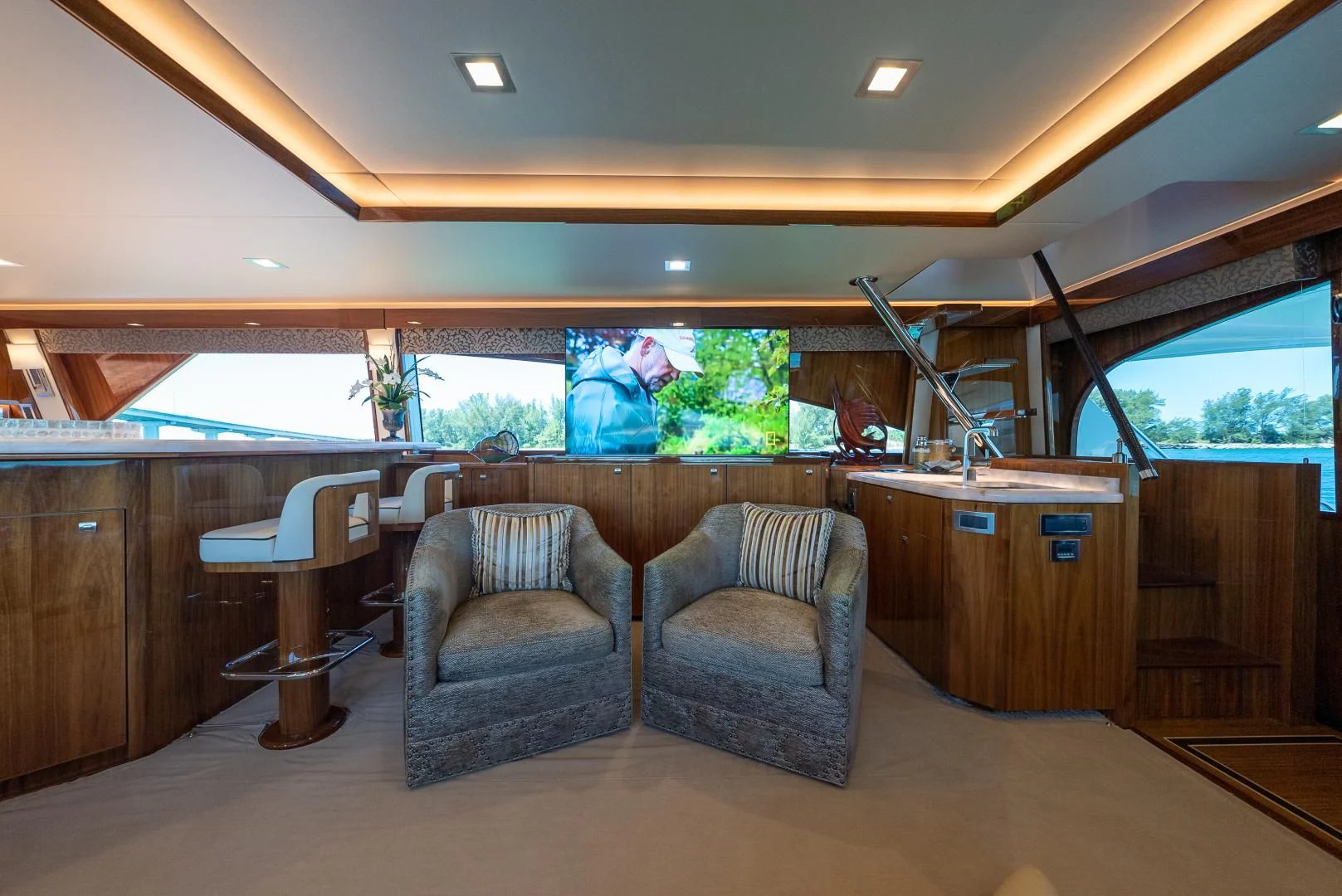 a room with chairs and tables aboard AFTER MIDNIGHT Yacht for Sale
