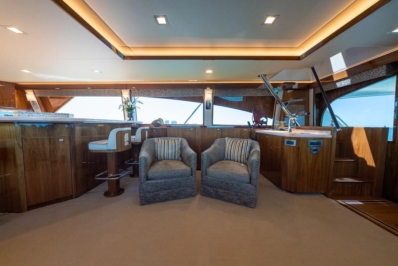 a room with chairs and a table aboard AFTER MIDNIGHT Yacht for Sale