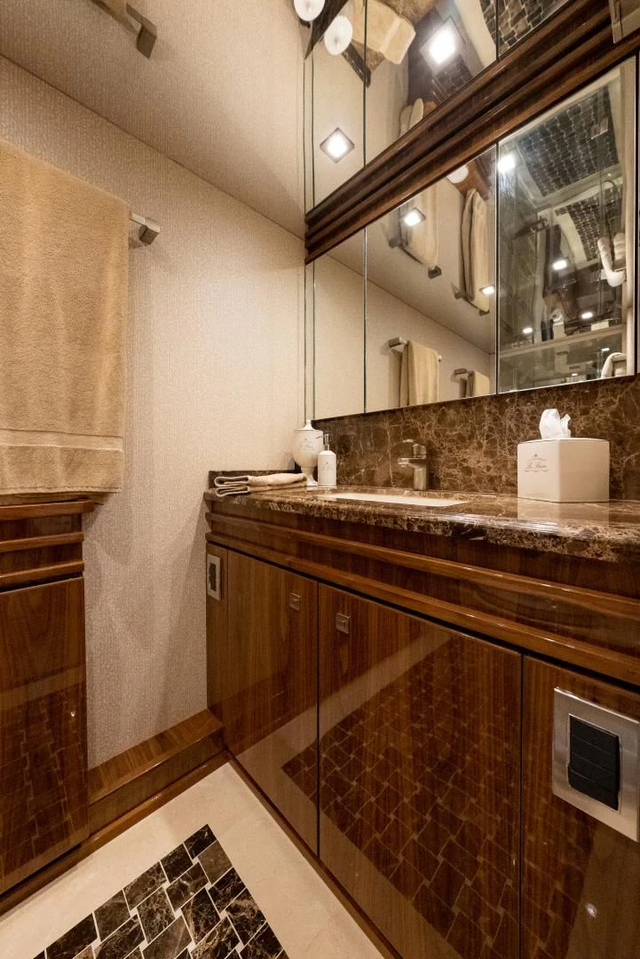 a bathroom with a marble counter top aboard AFTER MIDNIGHT Yacht for Sale