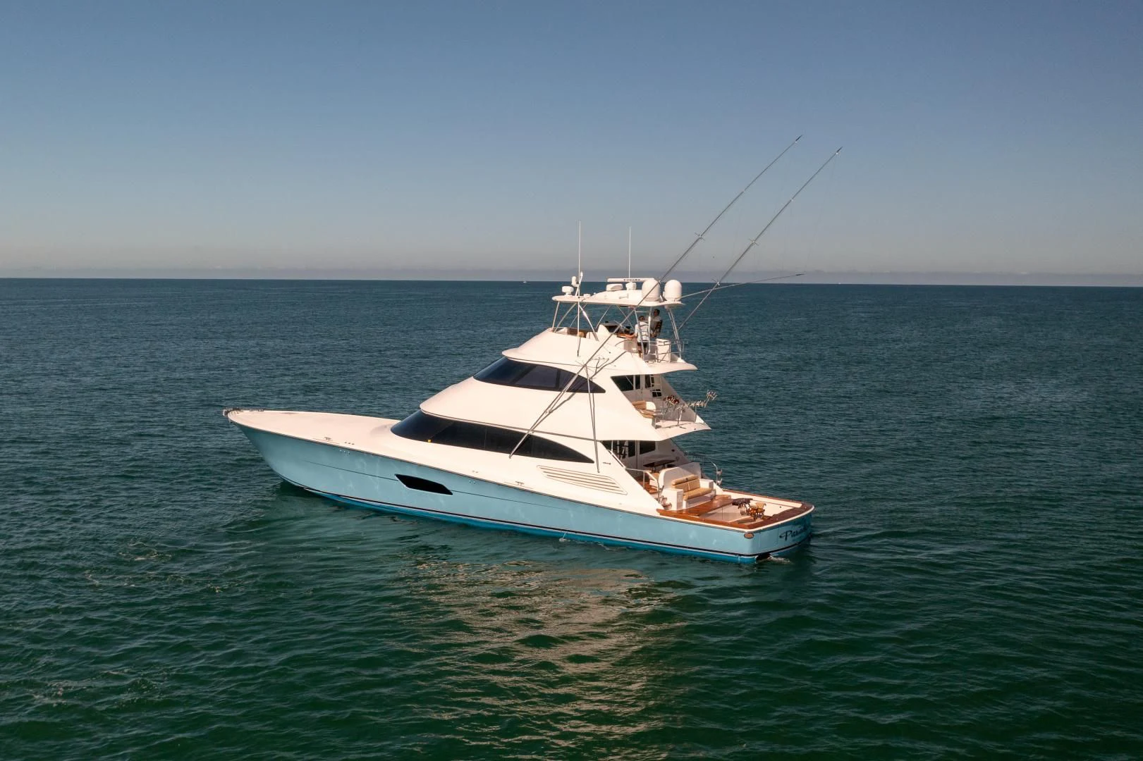 a white boat in the water aboard AFTER MIDNIGHT Yacht for Sale
