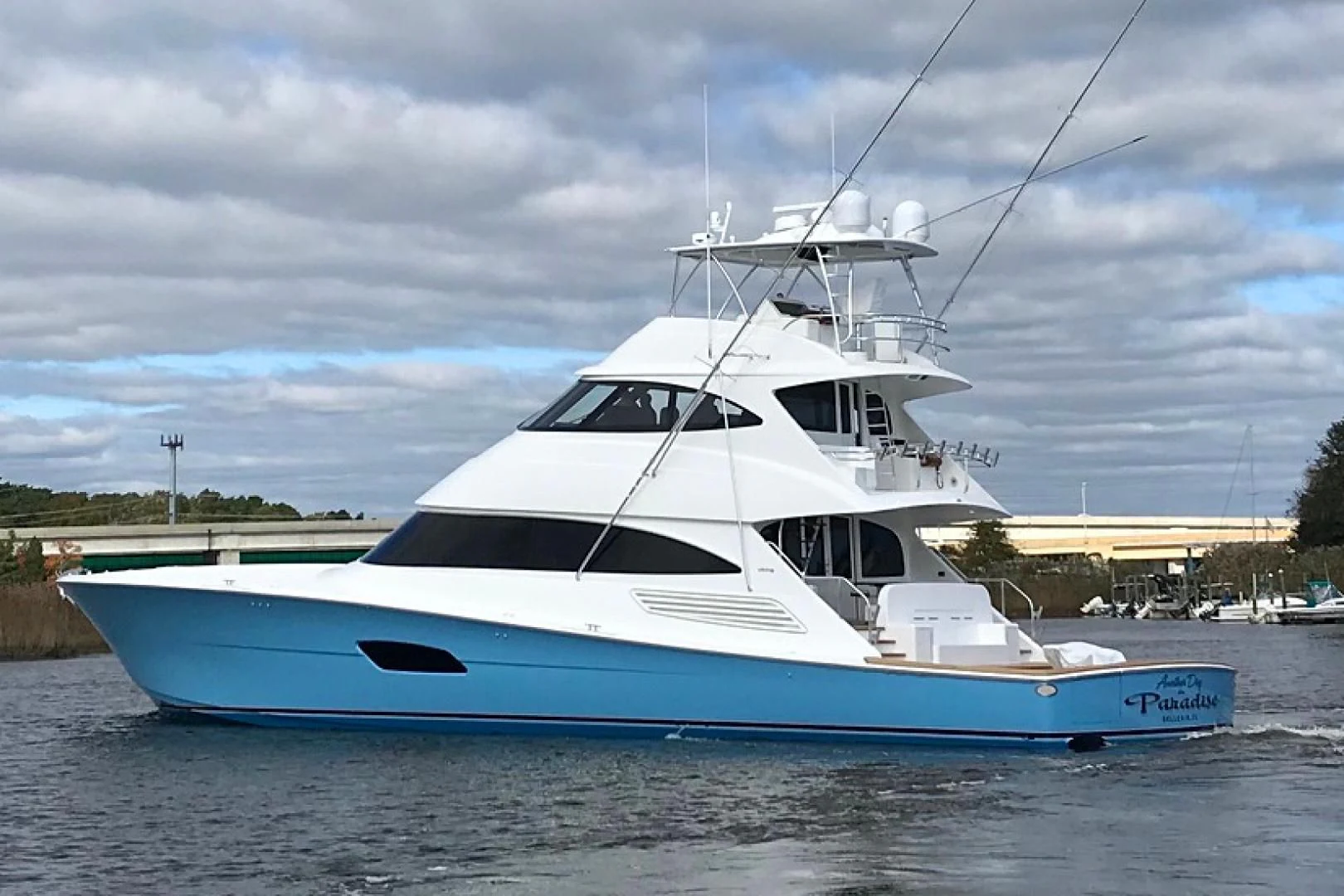 a white yacht on the water aboard AFTER MIDNIGHT Yacht for Sale