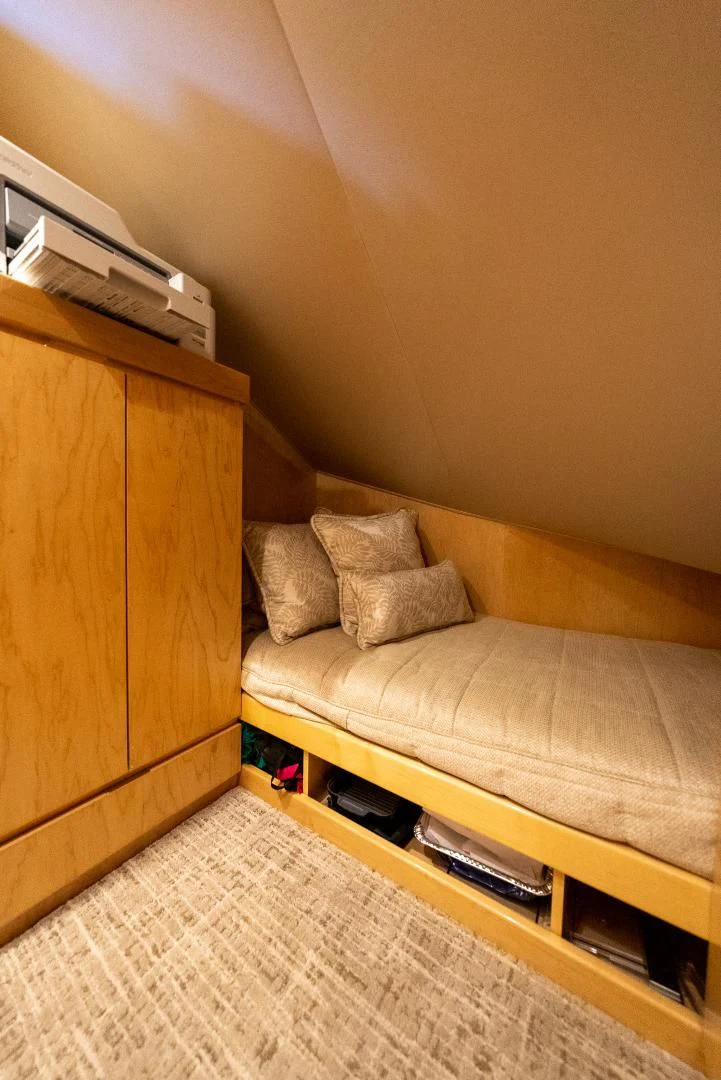 a couch and a table in a room aboard AFTER MIDNIGHT Yacht for Sale
