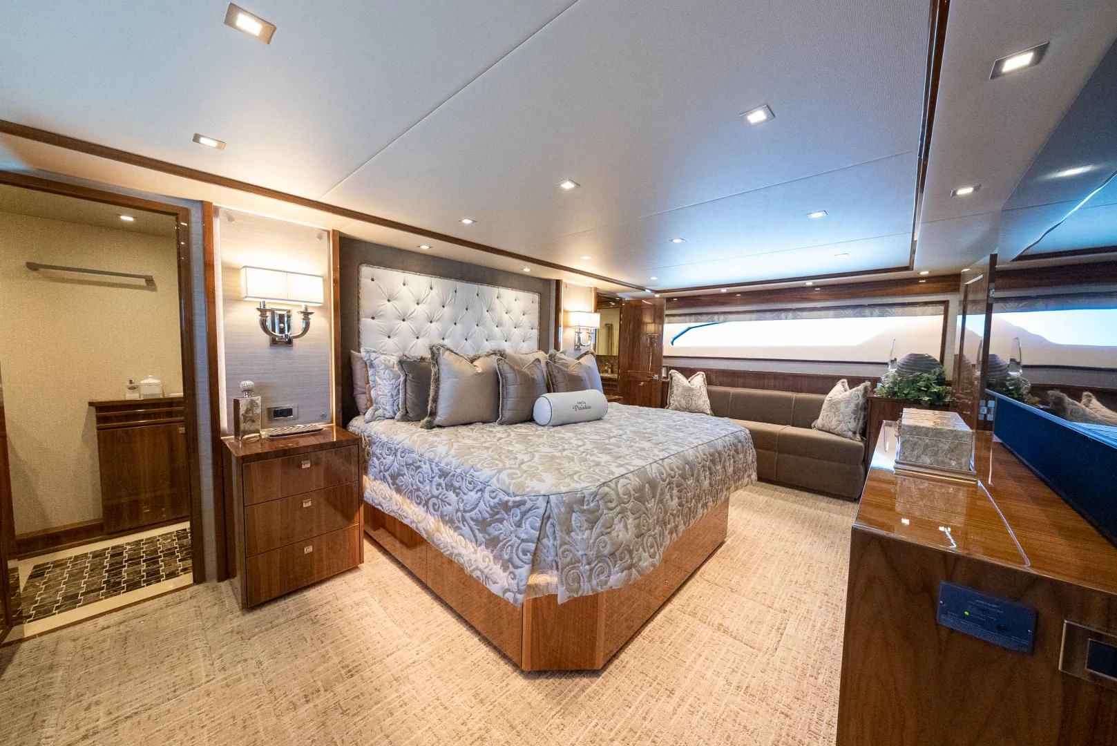 a large bedroom with a large bed aboard AFTER MIDNIGHT Yacht for Sale