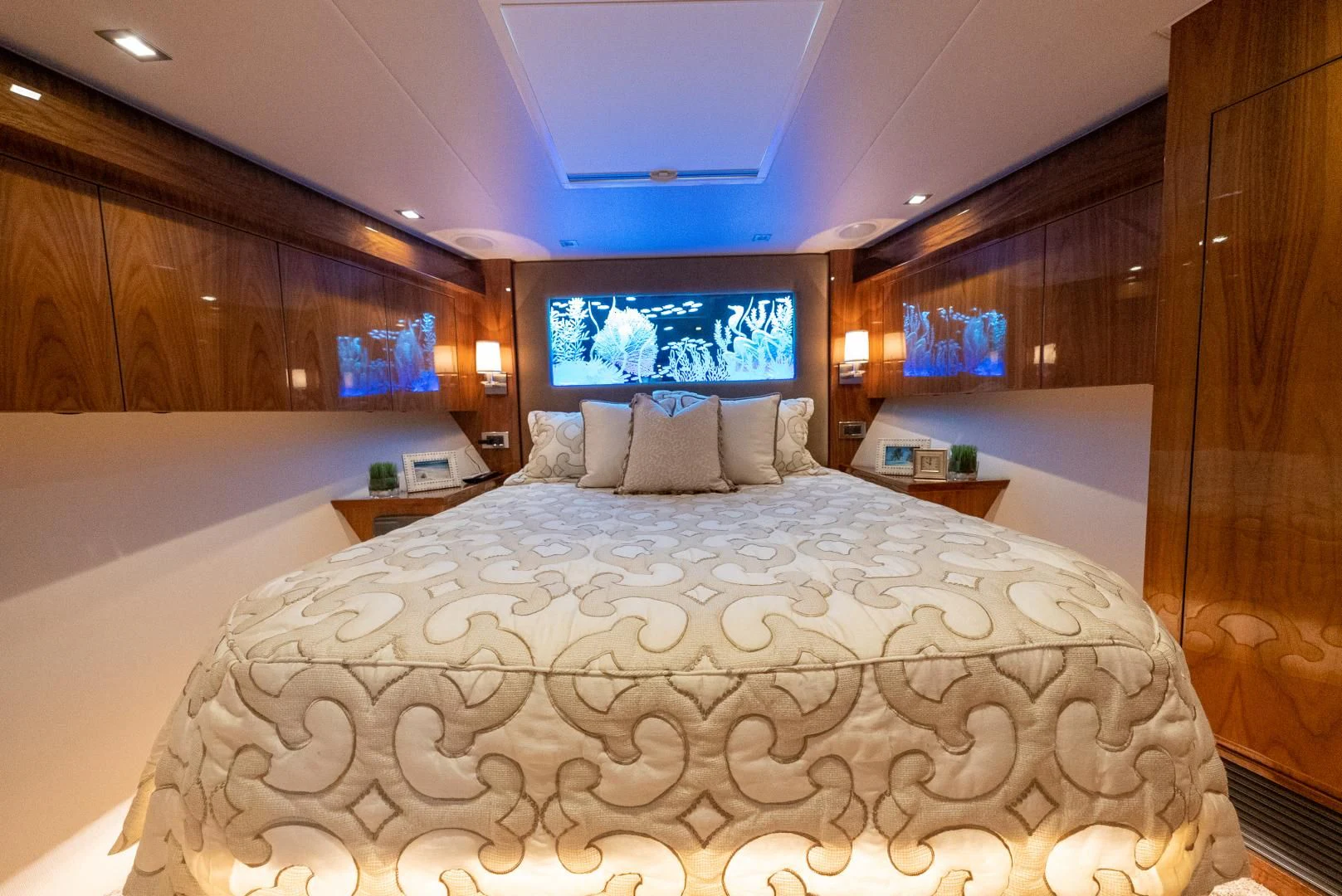 a bed with a large white bed aboard AFTER MIDNIGHT Yacht for Sale