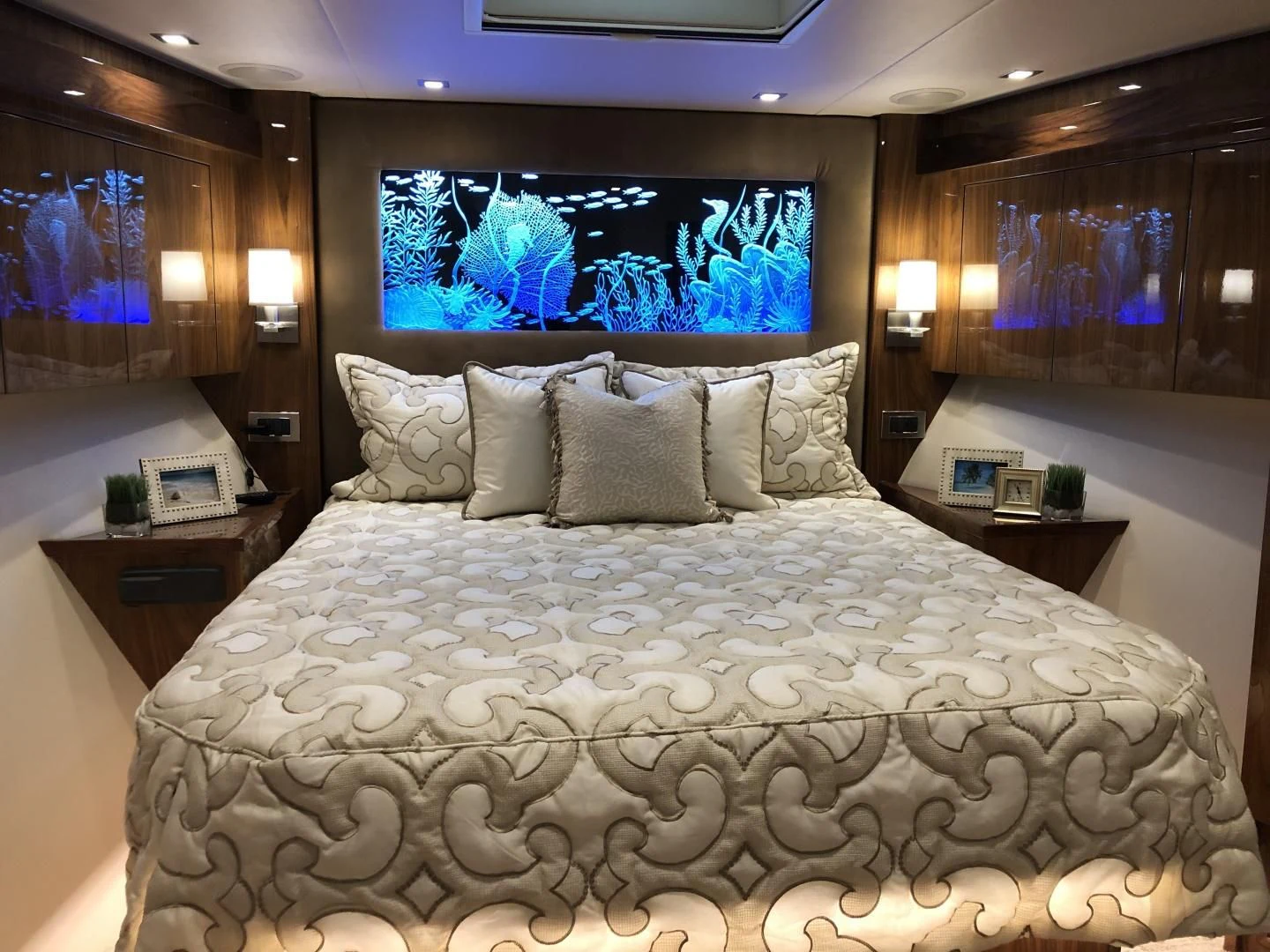 a bed with a large white bed spread aboard AFTER MIDNIGHT Yacht for Sale