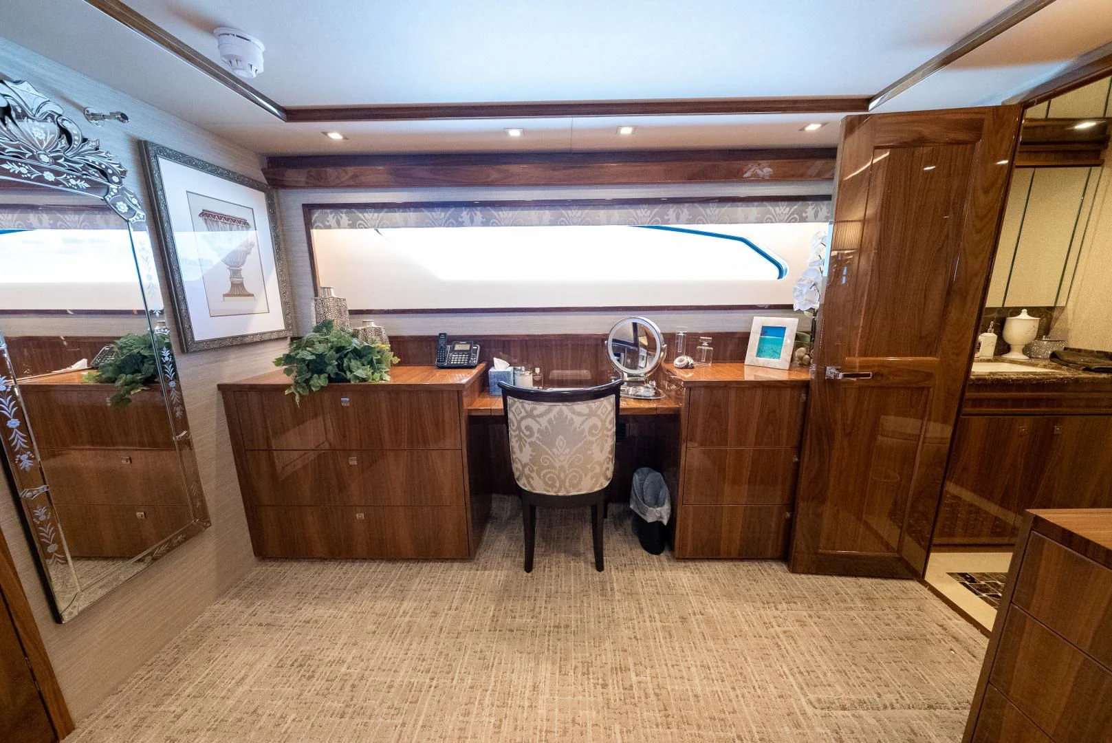 a room with a table and chairs aboard AFTER MIDNIGHT Yacht for Sale