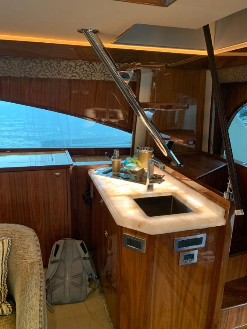 a bathroom with a large mirror aboard AFTER MIDNIGHT Yacht for Sale