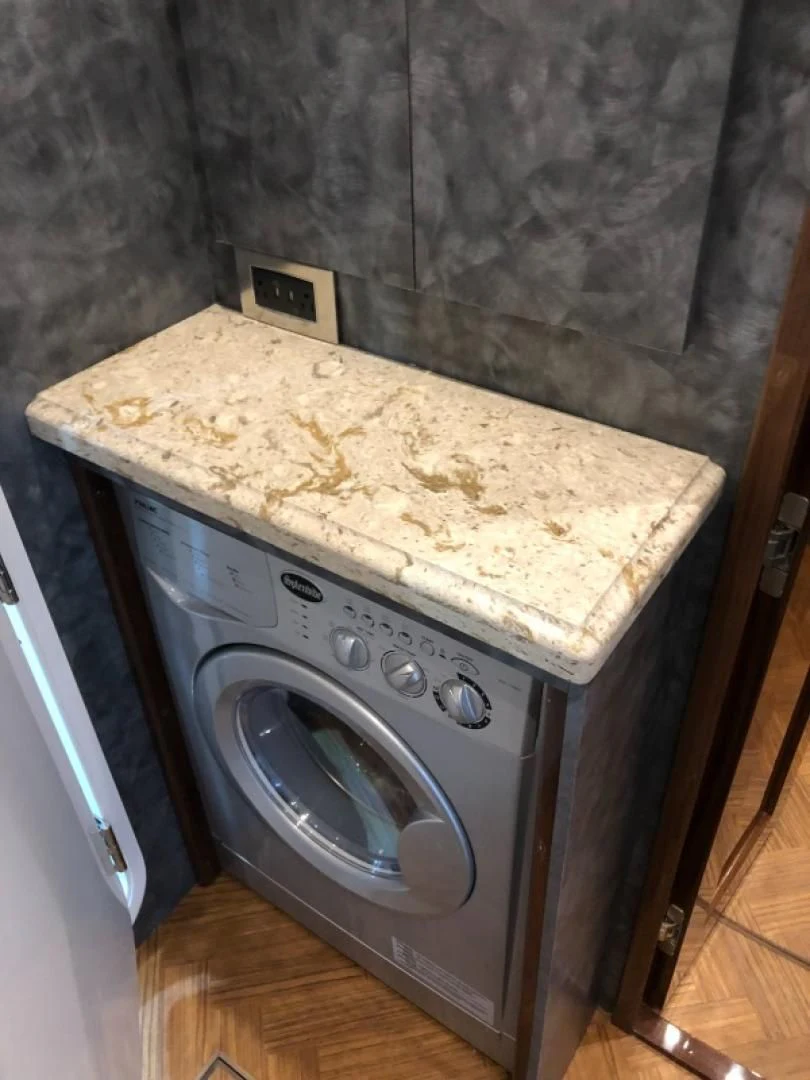 a kitchen with a stove aboard AFTER MIDNIGHT Yacht for Sale