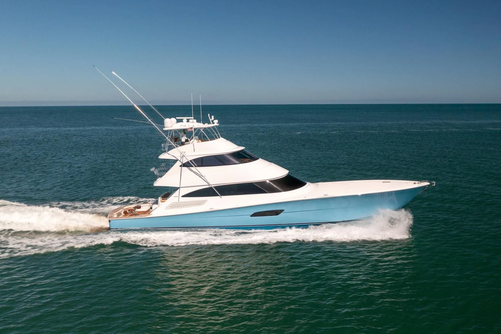 a white boat in the water aboard AFTER MIDNIGHT Yacht for Sale