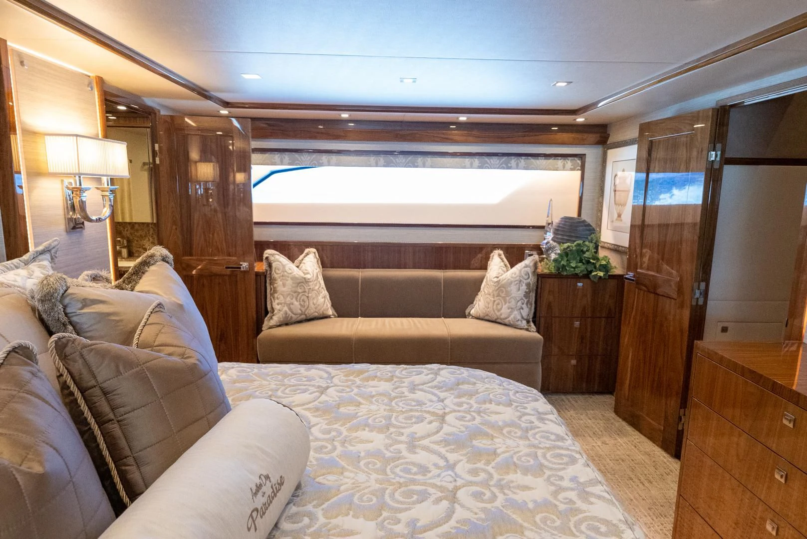 a bed and a couch in a room aboard AFTER MIDNIGHT Yacht for Sale
