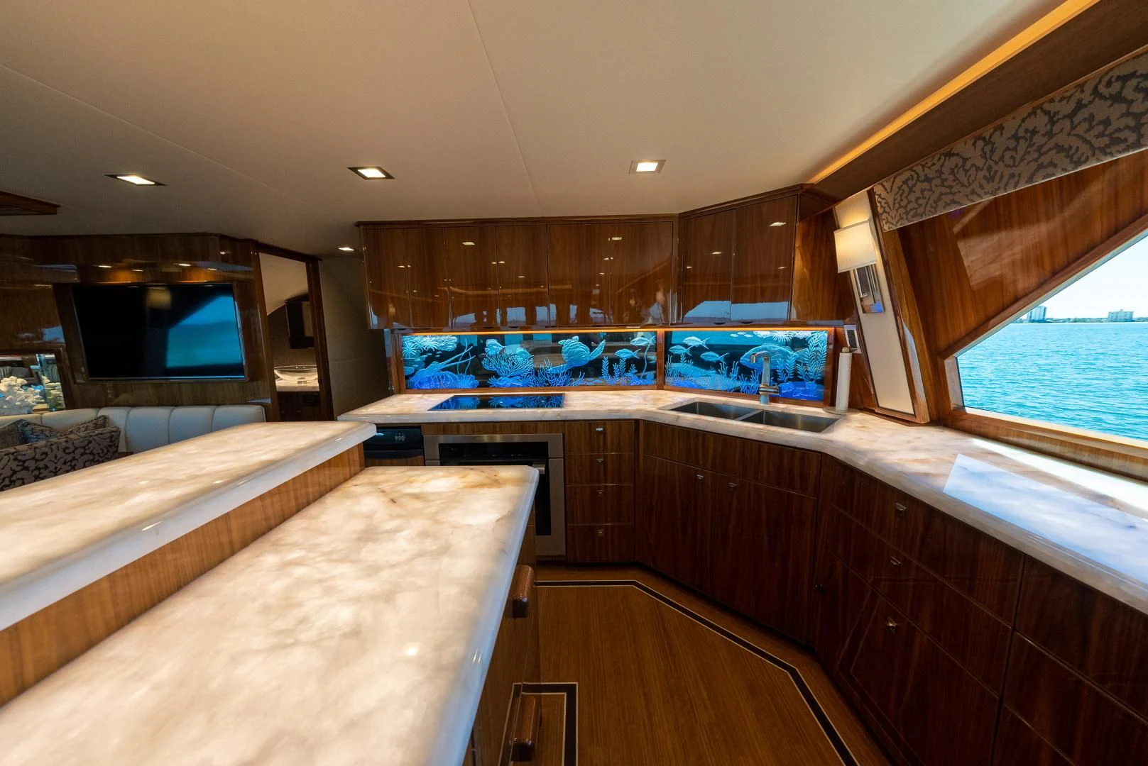 a room with a bed and a television aboard AFTER MIDNIGHT Yacht for Sale