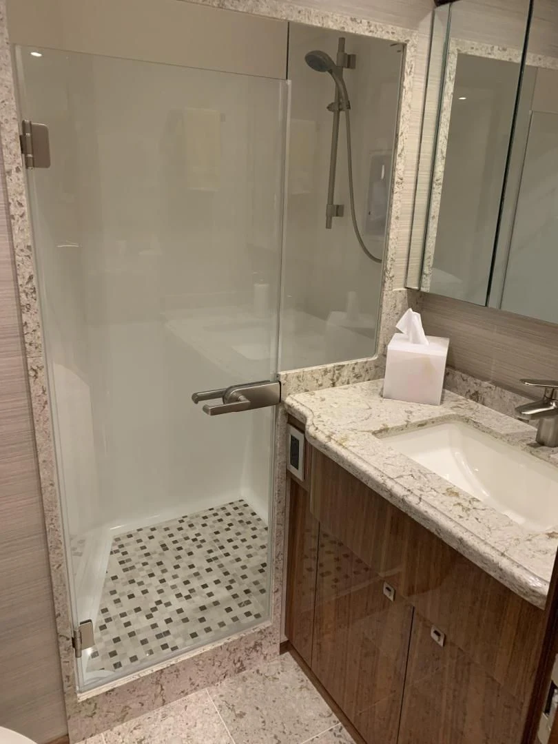 a bathroom with a sink and a shower aboard AFTER MIDNIGHT Yacht for Sale