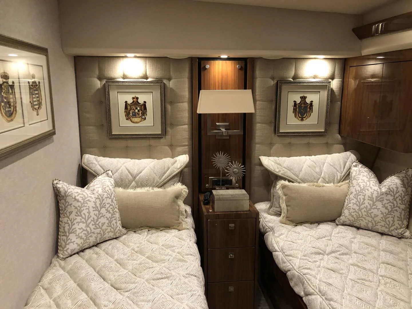 a bedroom with a bed and a mirror aboard AFTER MIDNIGHT Yacht for Sale