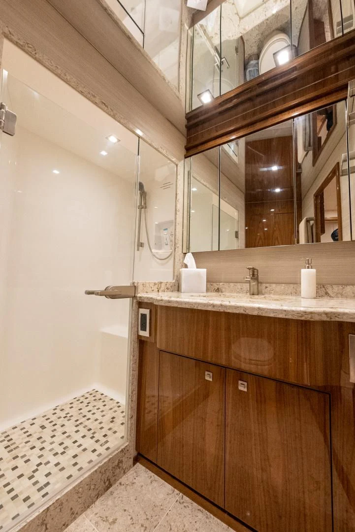 a bathroom with a large mirror aboard AFTER MIDNIGHT Yacht for Sale