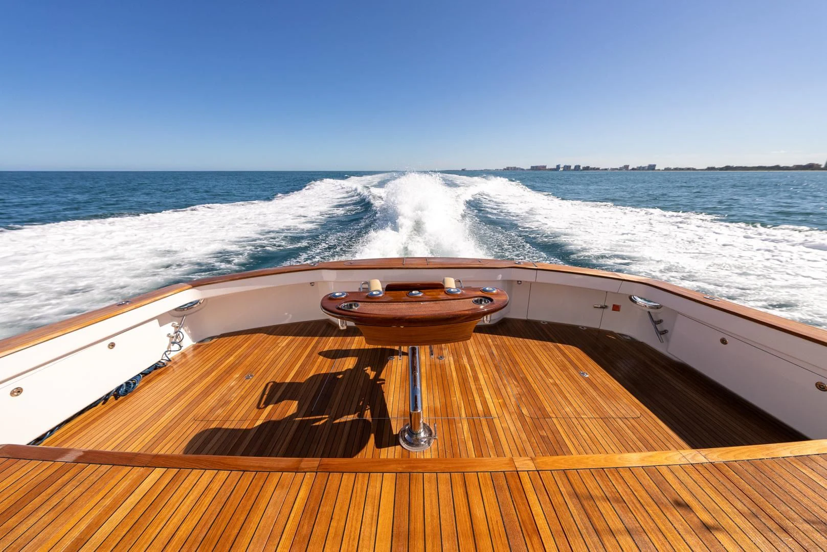 a wooden boat on the water aboard AFTER MIDNIGHT Yacht for Sale