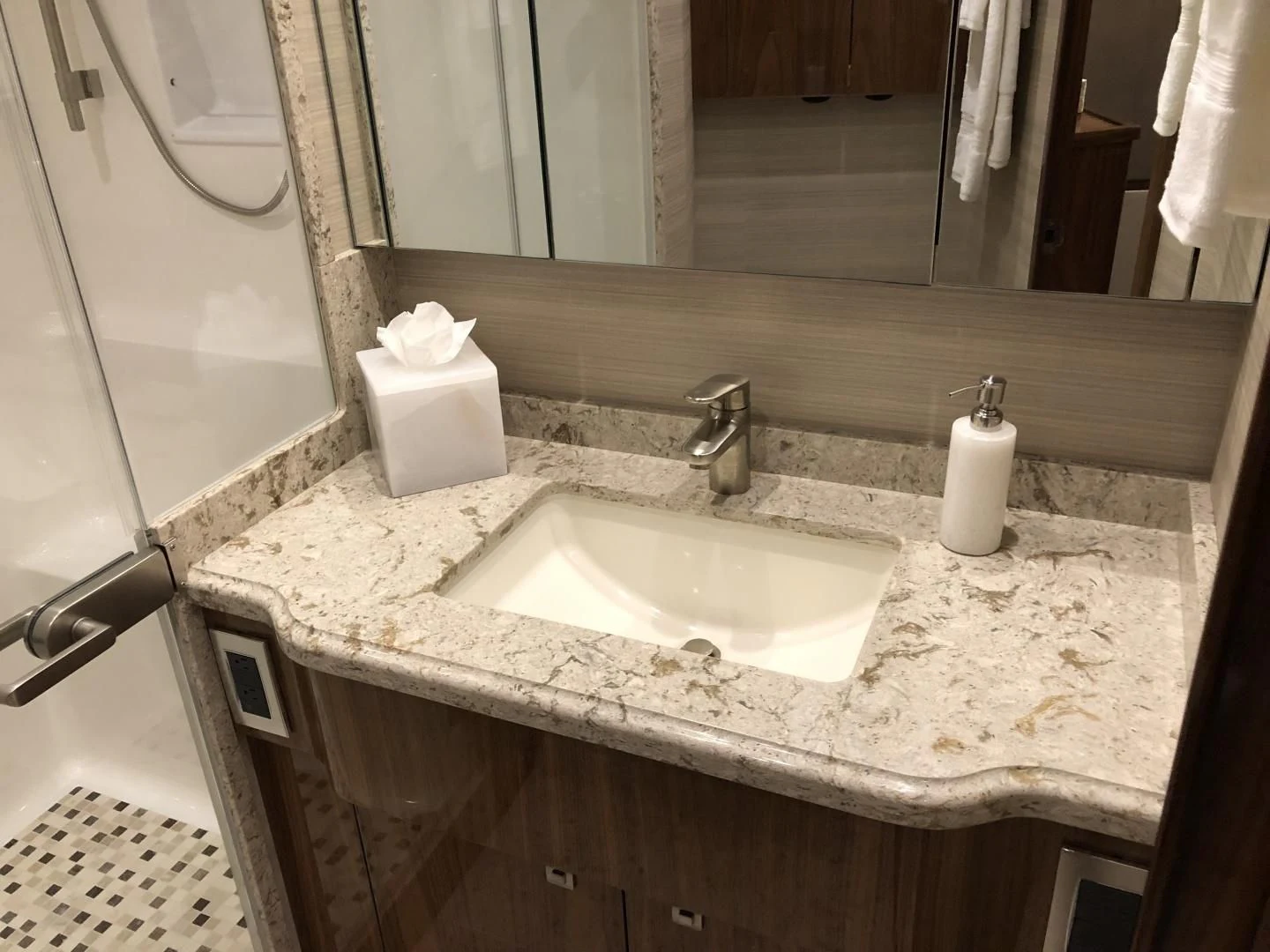 a bathroom sink with a mirror aboard AFTER MIDNIGHT Yacht for Sale
