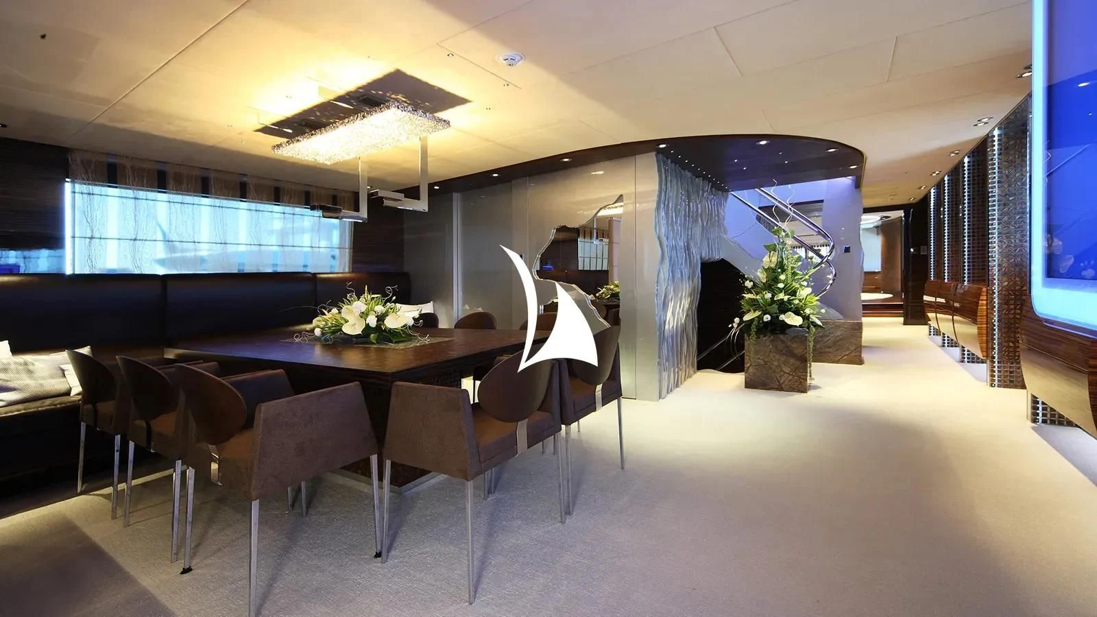 a room with a table and chairs aboard TIAMAT Yacht for Sale