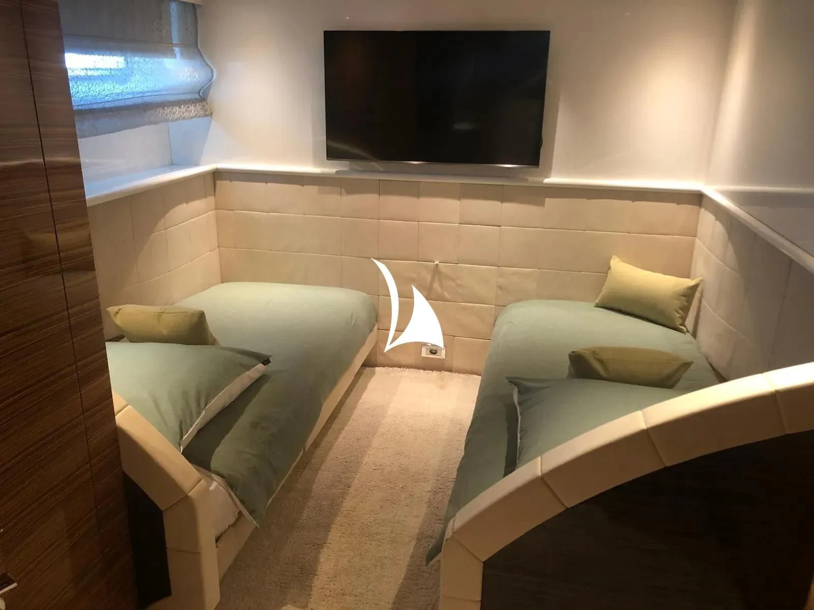 a room with a couple of beds aboard TIAMAT Yacht for Sale