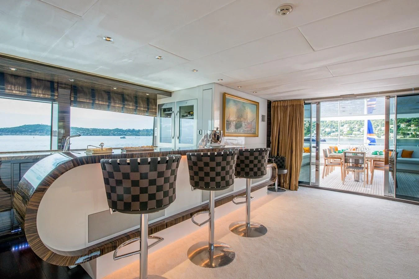 a large room with a table and chairs aboard TIAMAT Yacht for Sale