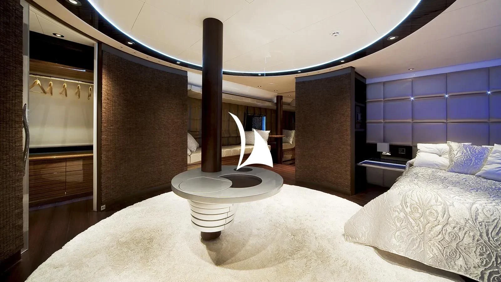 a bed with a lamp on it aboard TIAMAT Yacht for Sale