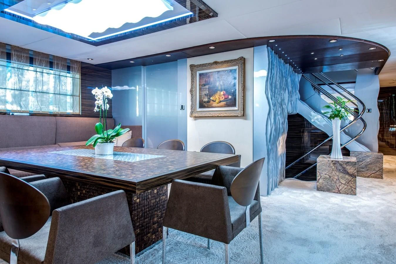a room with a table and chairs aboard TIAMAT Yacht for Sale