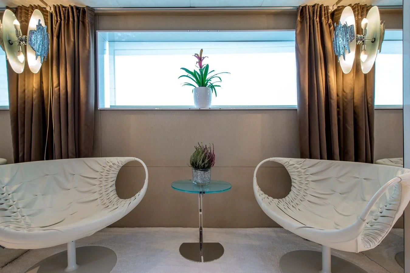 a room with a table and chairs aboard TIAMAT Yacht for Sale