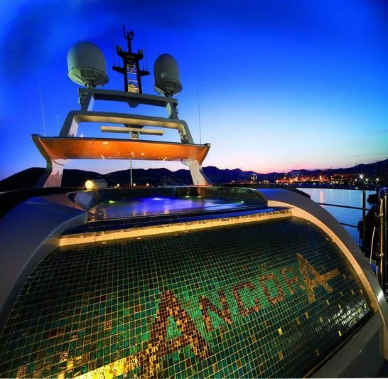 a boat with a large ship on it aboard TIAMAT Yacht for Sale