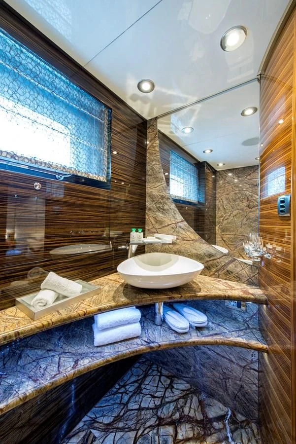 a bathroom with a sink and a mirror aboard TIAMAT Yacht for Sale