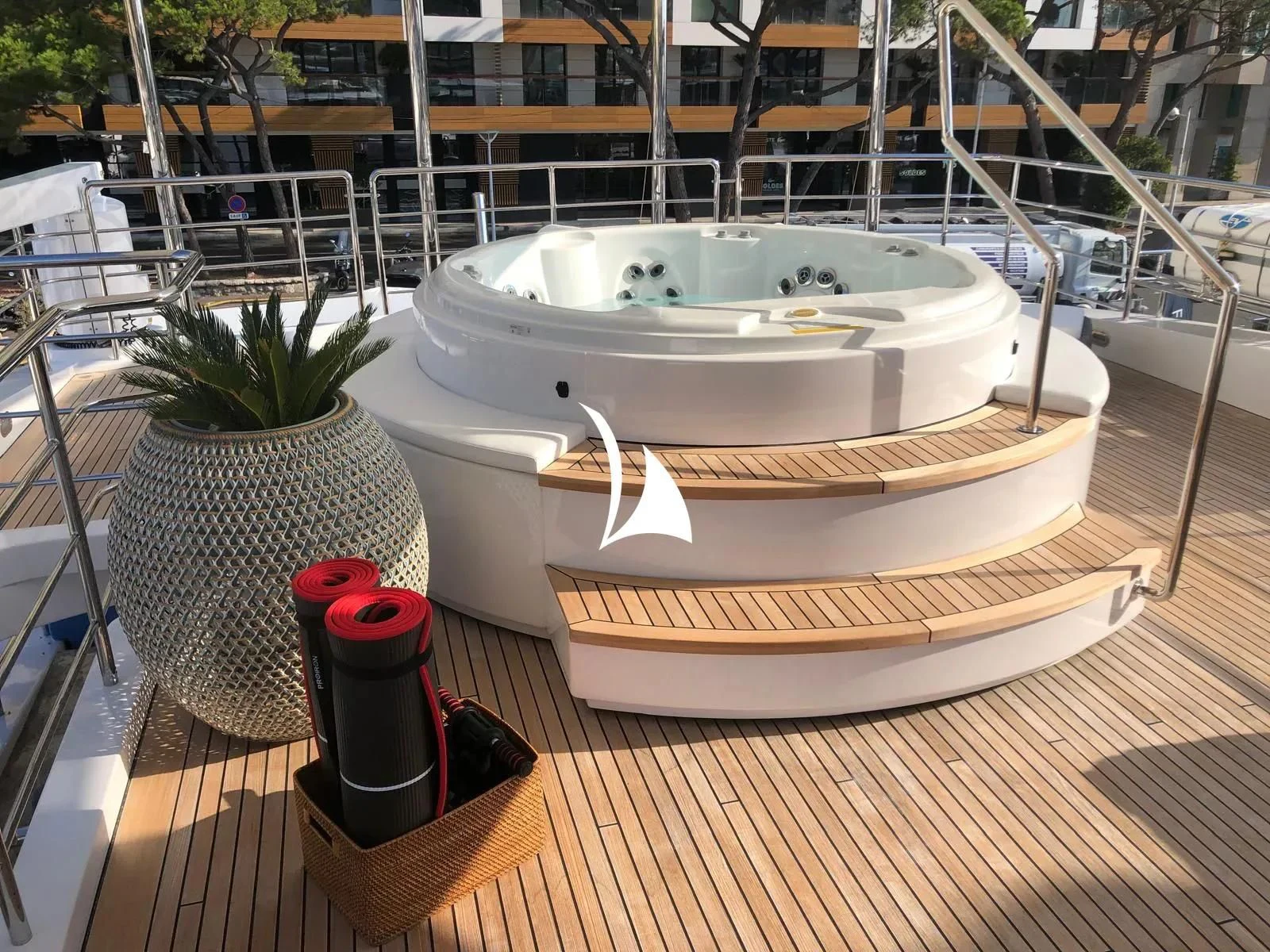 a white boat with a red and black object on it aboard TIAMAT Yacht for Sale